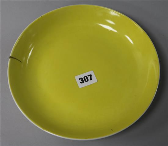 A Chinese yellow glazed dish, Jiaqing mark, gilt repair
